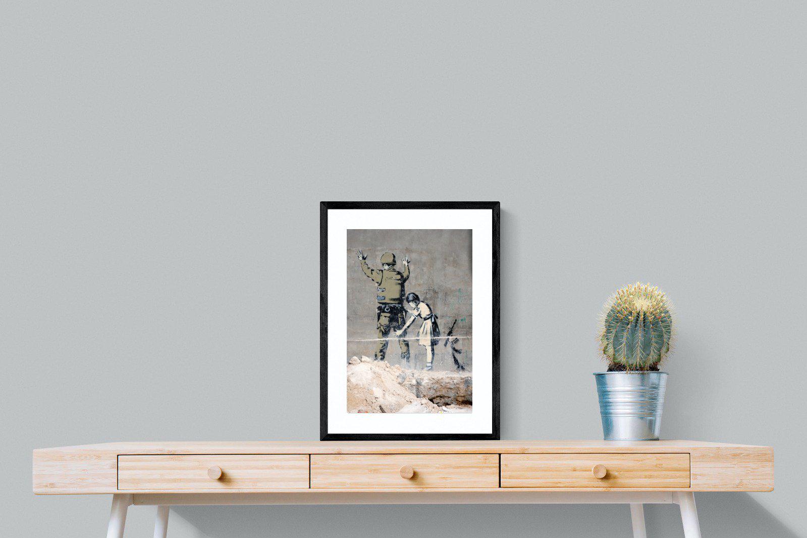 Girl Frisking Soldier-Wall_Art-45 x 60cm-Framed Print-Black-Pixalot