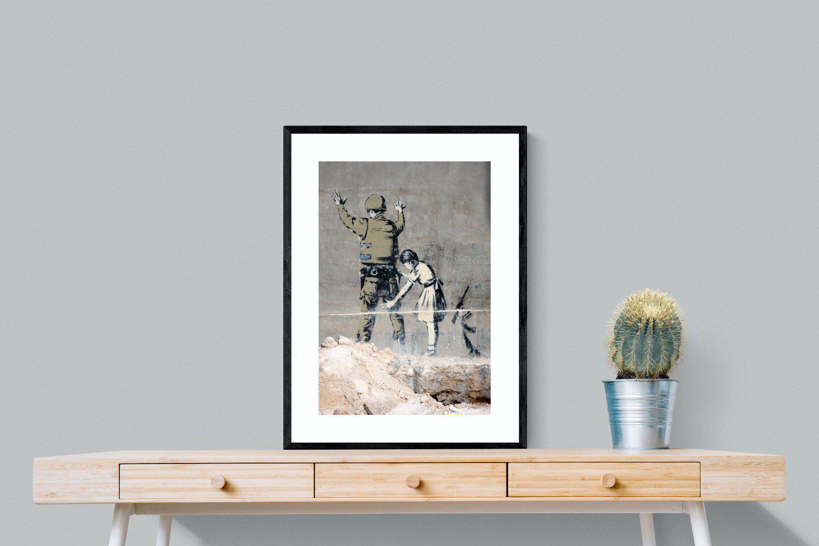 Girl Frisking Soldier-Wall_Art-60 x 80cm-Framed Print-Black-Pixalot