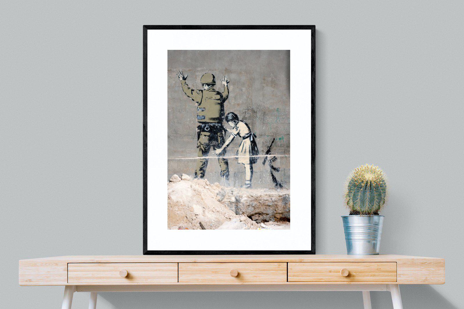 Girl Frisking Soldier-Wall_Art-75 x 100cm-Framed Print-Black-Pixalot